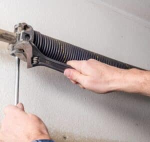 how to repair garage door spring